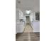 Galley-style kitchen with white cabinets at 1075 S Hiawassee Rd # 912, Orlando, FL 32835