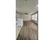 Bright living room featuring wood-look flooring and lots of natural light at 1075 S Hiawassee Rd # 912, Orlando, FL 32835