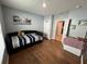 Bedroom with daybed and access to the bathroom at 120 Panda Way, Davenport, FL 33837