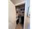 Shelved closet with clothing and linens at 120 Panda Way, Davenport, FL 33837