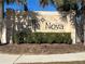 Bella Nova community entrance sign with landscaping at 120 Panda Way, Davenport, FL 33837