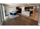 Dining area with hardwood floors and modern glass dining table at 120 Panda Way, Davenport, FL 33837