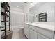 Well-appointed bathroom with a bathtub, shower, and updated vanity at 12549 Encore At Ovation Way, Winter Garden, FL 34787