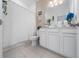 Clean bathroom with white vanity, shower/tub combo and updated fixtures at 12549 Encore At Ovation Way, Winter Garden, FL 34787