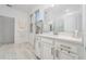 Clean bathroom with white cabinets and tiled floors at 12549 Encore At Ovation Way, Winter Garden, FL 34787