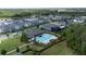 Community pool with surrounding patio and landscaping at 12549 Encore At Ovation Way, Winter Garden, FL 34787