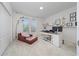 Light-filled home office with built-in shelving and comfortable seating at 12549 Encore At Ovation Way, Winter Garden, FL 34787