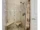 Walk-in shower with tiled walls and built in seat at 1311 Sardinia Ct, Davenport, FL 33896