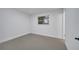 Bright bedroom with neutral walls and grey flooring at 1414 Vonderay Rd, Orlando, FL 32825