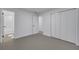 Spacious bedroom with grey flooring and built-in closet at 1414 Vonderay Rd, Orlando, FL 32825