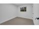 Bright bedroom with grey flooring and a window offering natural light at 1414 Vonderay Rd, Orlando, FL 32825