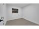 Well-lit bedroom featuring grey flooring and white walls at 1414 Vonderay Rd, Orlando, FL 32825