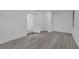 Spacious bedroom with grey flooring and access to hallway at 1414 Vonderay Rd, Orlando, FL 32825