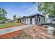 Newly renovated home with a teal door and modern exterior at 1414 Vonderay Rd, Orlando, FL 32825