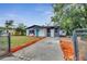 Newly renovated home with a teal door and modern exterior at 1414 Vonderay Rd, Orlando, FL 32825