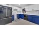 Modern kitchen with blue cabinets, white countertops, and stainless steel appliances at 1414 Vonderay Rd, Orlando, FL 32825