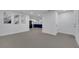 Open concept living room with a view of the modern kitchen at 1414 Vonderay Rd, Orlando, FL 32825