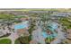 Aerial view of community with pools and clubhouse at 1455 Rolling Fairway Dr, Davenport, FL 33896