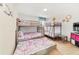 Fun bunk beds with flamingo bedding at 1455 Rolling Fairway Dr, Davenport, FL 33896