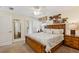 Main bedroom with king bed and private bathroom access at 1455 Rolling Fairway Dr, Davenport, FL 33896