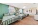Bedroom with two twin beds and teal color scheme at 1455 Rolling Fairway Dr, Davenport, FL 33896