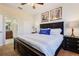 King-size bed and ensuite bathroom in a bright bedroom at 1455 Rolling Fairway Dr, Davenport, FL 33896