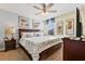 King-size bed, nightstands, and artwork in a well-appointed bedroom at 1455 Rolling Fairway Dr, Davenport, FL 33896