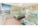 Two twin beds in a light and airy bedroom at 1455 Rolling Fairway Dr, Davenport, FL 33896