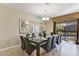 Large dining table with seating for ten, overlooking the pool at 1455 Rolling Fairway Dr, Davenport, FL 33896