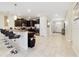 Kitchen with breakfast bar, stainless steel appliances, and granite countertops at 1455 Rolling Fairway Dr, Davenport, FL 33896