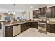 Spacious kitchen with dark cabinetry and stainless steel appliances at 1455 Rolling Fairway Dr, Davenport, FL 33896