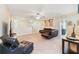 Open living area with leather furniture and high ceilings at 1455 Rolling Fairway Dr, Davenport, FL 33896