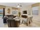 Comfortable living room with leather sectional sofa and large TV at 1455 Rolling Fairway Dr, Davenport, FL 33896