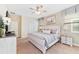Bright and airy main bedroom, featuring a king-size bed and plenty of closet space at 1455 Rolling Fairway Dr, Davenport, FL 33896