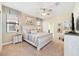 Relaxing main bedroom with a king-size bed, ample natural light, and ensuite bathroom at 1455 Rolling Fairway Dr, Davenport, FL 33896