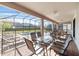 Covered patio overlooking a private pool and backyard at 1455 Rolling Fairway Dr, Davenport, FL 33896