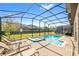 Relaxing pool and spa area with lounge chairs at 1455 Rolling Fairway Dr, Davenport, FL 33896