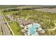 Aerial view of community pool with surrounding lounge area and parking at 1516 Quinta Rd, Kissimmee, FL 34744