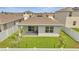 Single-story home with backyard and patio at 1516 Quinta Rd, Kissimmee, FL 34744