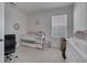 Bedroom with crib, changing table, and plenty of storage at 1516 Quinta Rd, Kissimmee, FL 34744