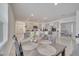 Bright dining area with table and chairs, open to kitchen and Gathering room at 1516 Quinta Rd, Kissimmee, FL 34744