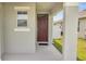 Exterior front door entrance with a covered porch at 1516 Quinta Rd, Kissimmee, FL 34744