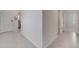 Spacious hallway showcasing tile flooring and access to rooms at 1516 Quinta Rd, Kissimmee, FL 34744
