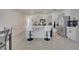 Modern kitchen with gray cabinets and island, open to dining area at 1516 Quinta Rd, Kissimmee, FL 34744