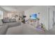 Open living room with sectional sofa and view into kitchen at 1516 Quinta Rd, Kissimmee, FL 34744