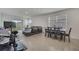 Spacious living room with sectional sofa and access to backyard at 1516 Quinta Rd, Kissimmee, FL 34744
