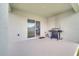 Covered patio with sliding door access and grill at 1516 Quinta Rd, Kissimmee, FL 34744