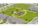 Community playground surrounded by lush green space at 1516 Quinta Rd, Kissimmee, FL 34744