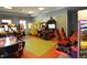Fun-filled game room featuring various arcade games and racing simulators at 1560 Flange Dr, Davenport, FL 33896