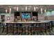 Upscale community bar with a large countertop and comfortable seating at 1560 Flange Dr, Davenport, FL 33896